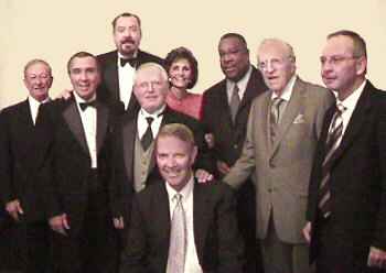 (Left to right) John Carlton, Pat Delsi, Bill Webber, Tom Moran, Harry Kalas, Marciarose Shestack, Vernon Odom, Frank Ford & Frank Hogan